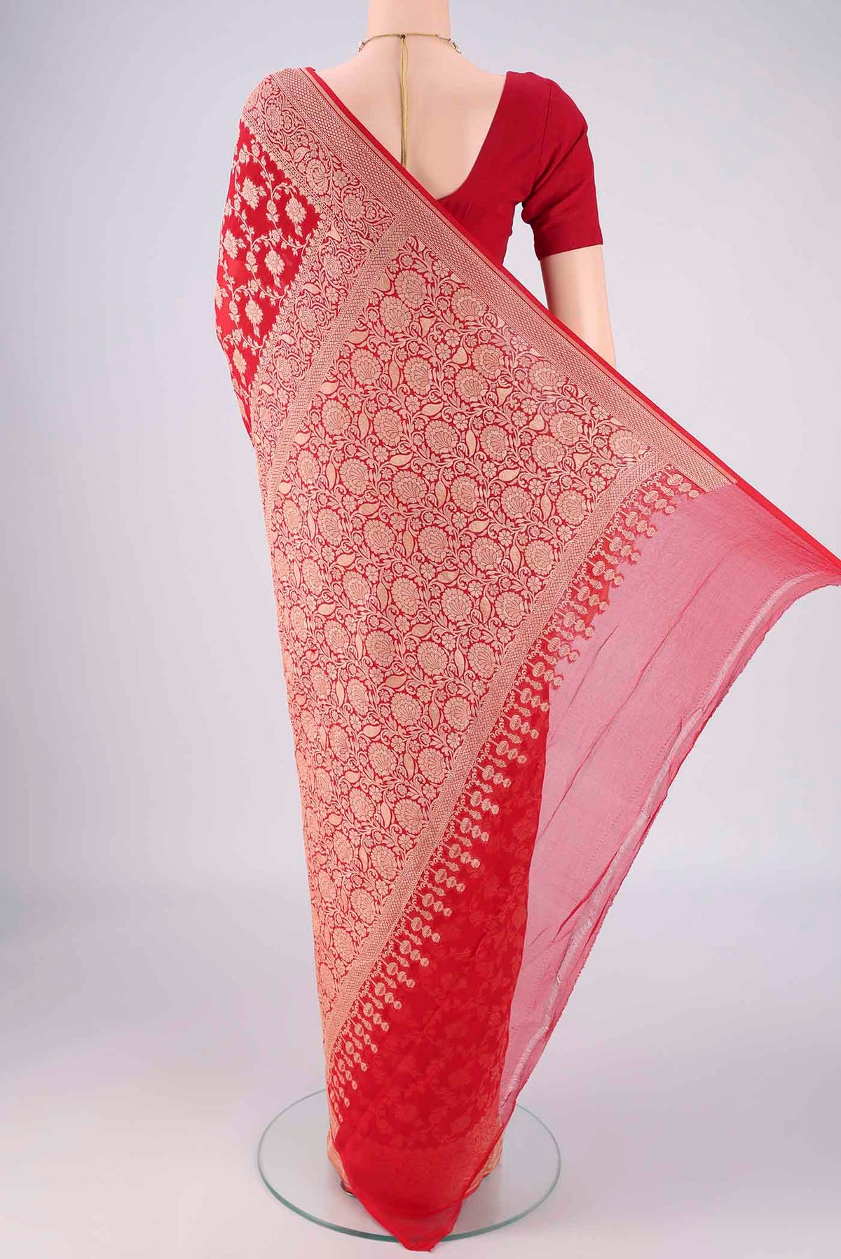 Flat view of Red Banarasi Georgette Saree with Zari Brocade on the body and Zari Border. 