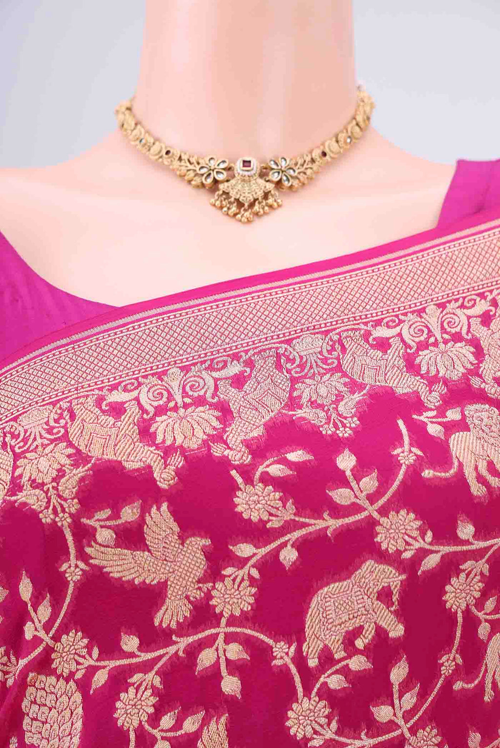 Border image of Rani Pink Banarasi Georgette Saree with Zari Brocade on the body and Zari Border. 