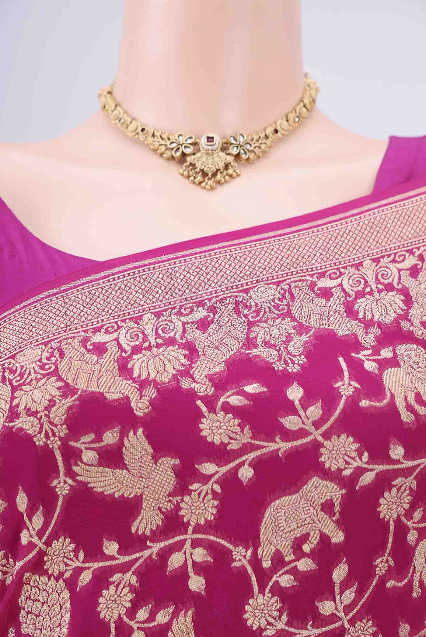 Border image of Rani Pink Banarasi Georgette Saree with Zari Brocade on the body and Zari Border. 