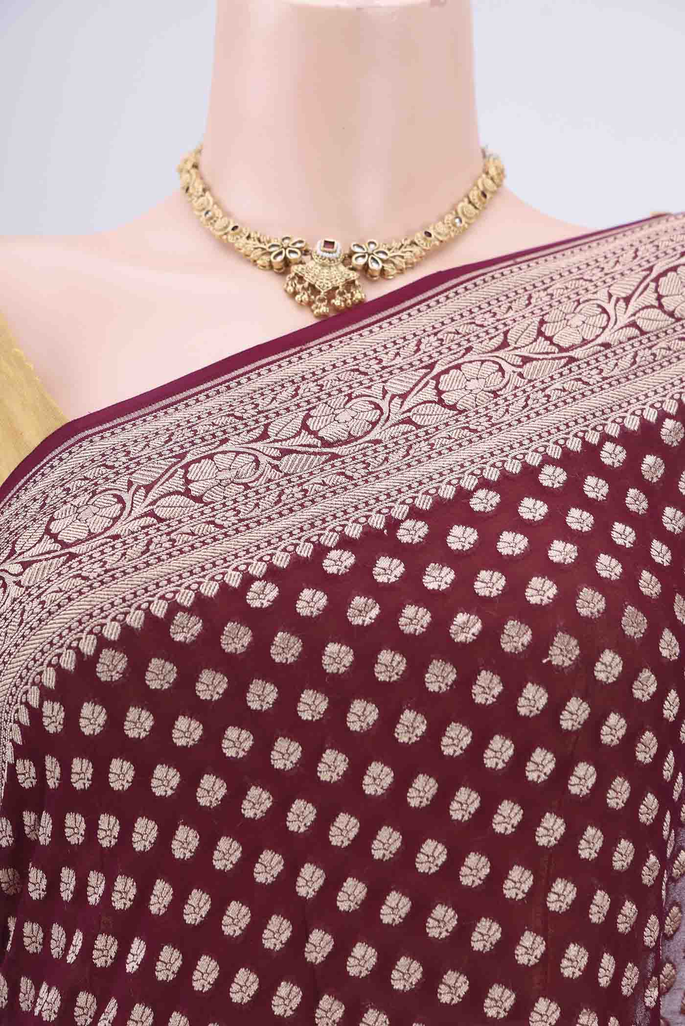 Border image of Maroon Banarasi Georgette Saree with Zari Butta on the body and Zari Border. 