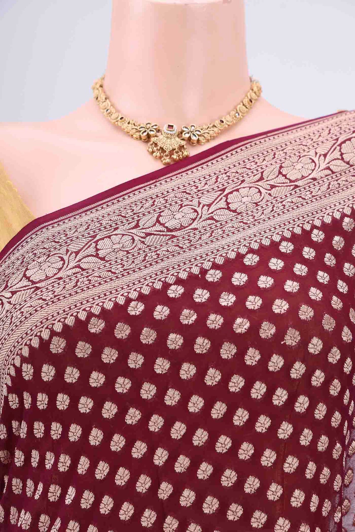 Border image of Maroon Banarasi Georgette Saree with Zari Butta on the body and Zari Border. 