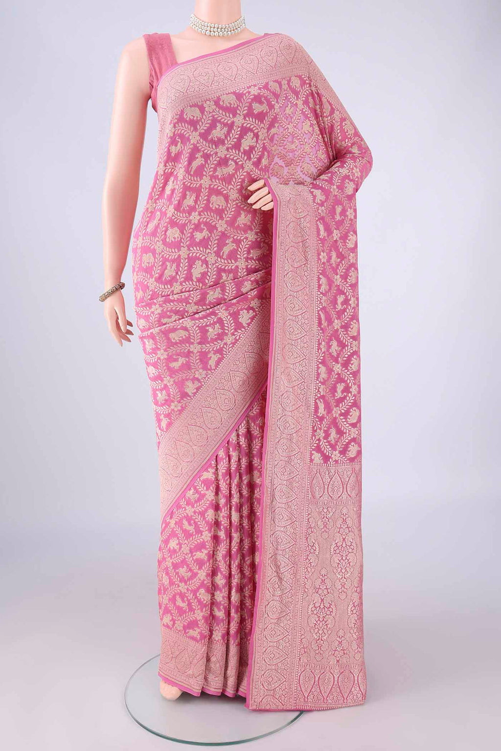 Rose pink Banarasi Georgette Saree with Zari Brocade on the body and Zari Border.  displayed on a mannequin