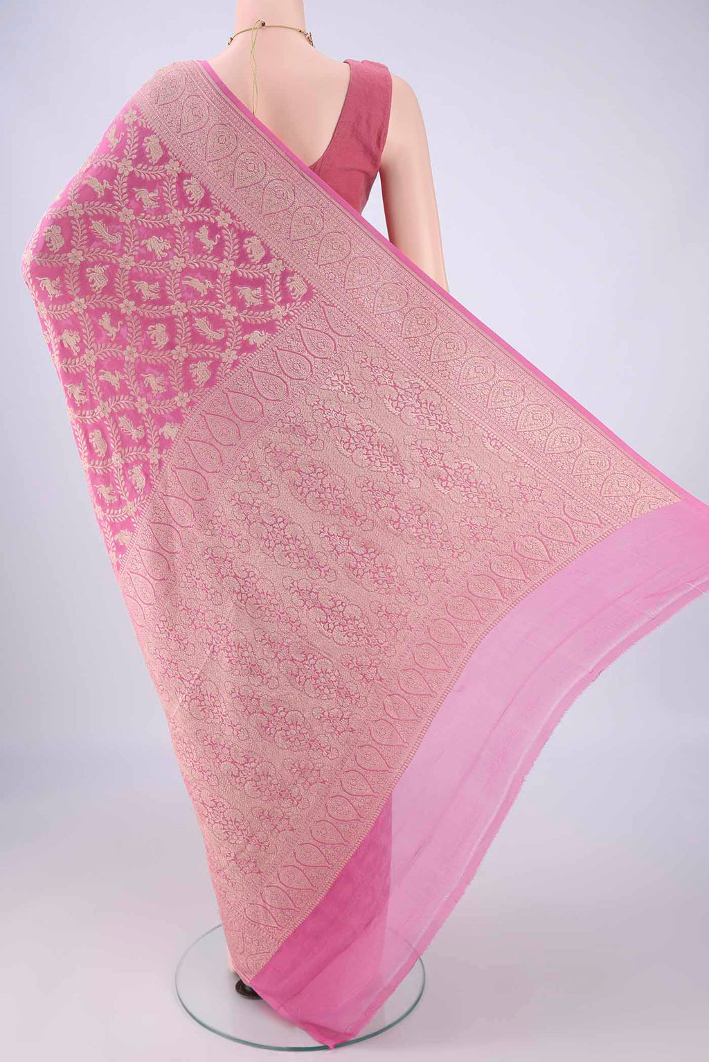 Flat view of Rose pink Banarasi Georgette Saree with Zari Brocade on the body and Zari Border. 