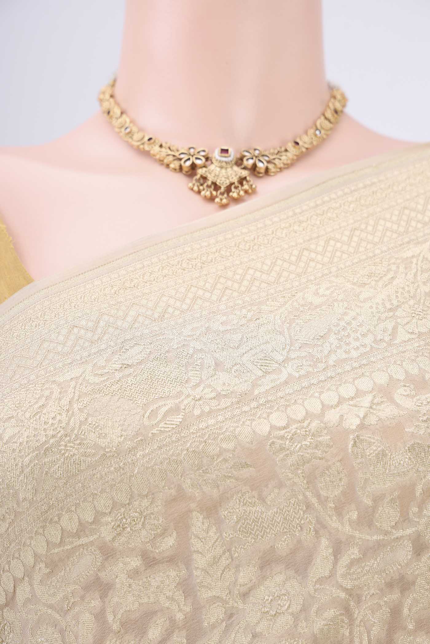 Border image of Beige Banarasi Georgette Saree with Zari Brocade on the body and Zari Border. 