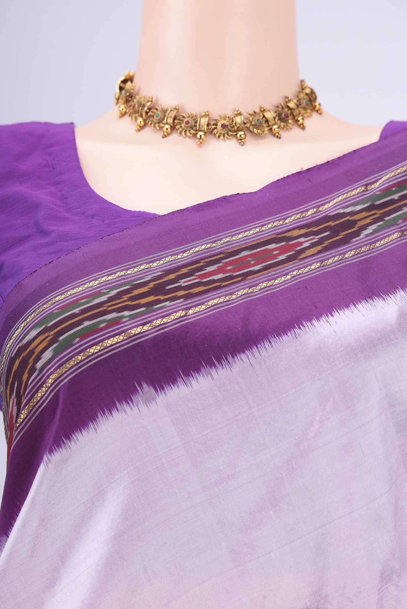 Border image of Lilac Pochampally Silk Saree with Plain Body and Ikat Border. 