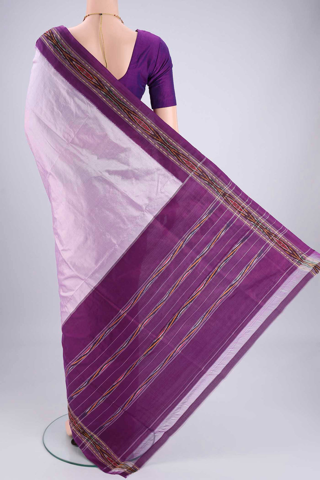 Flat view of Lilac Pochampally Silk Saree with Plain Body and Ikat Border. 