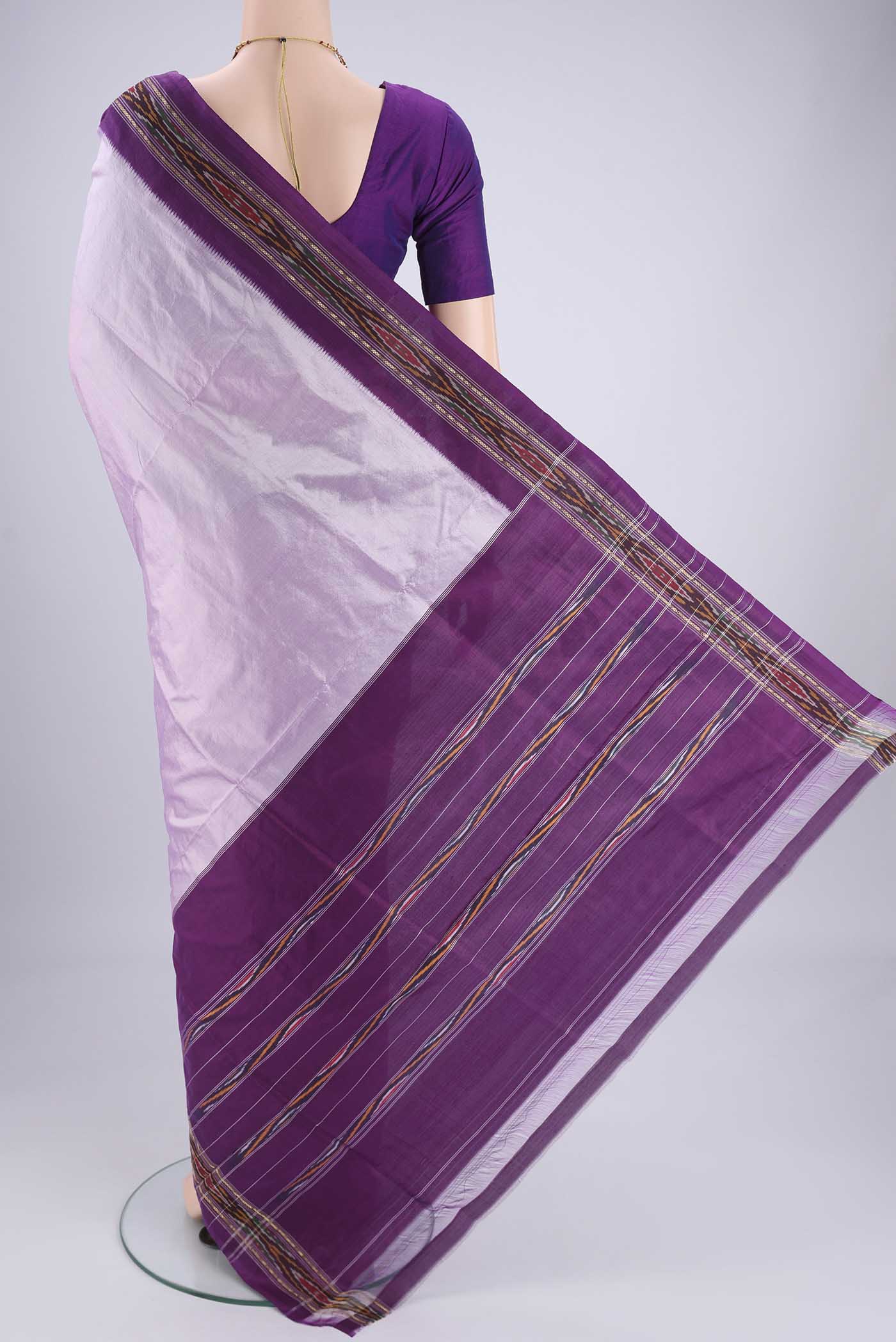 Flat view of Lilac Pochampally Silk Saree with Plain Body and Ikat Border. 