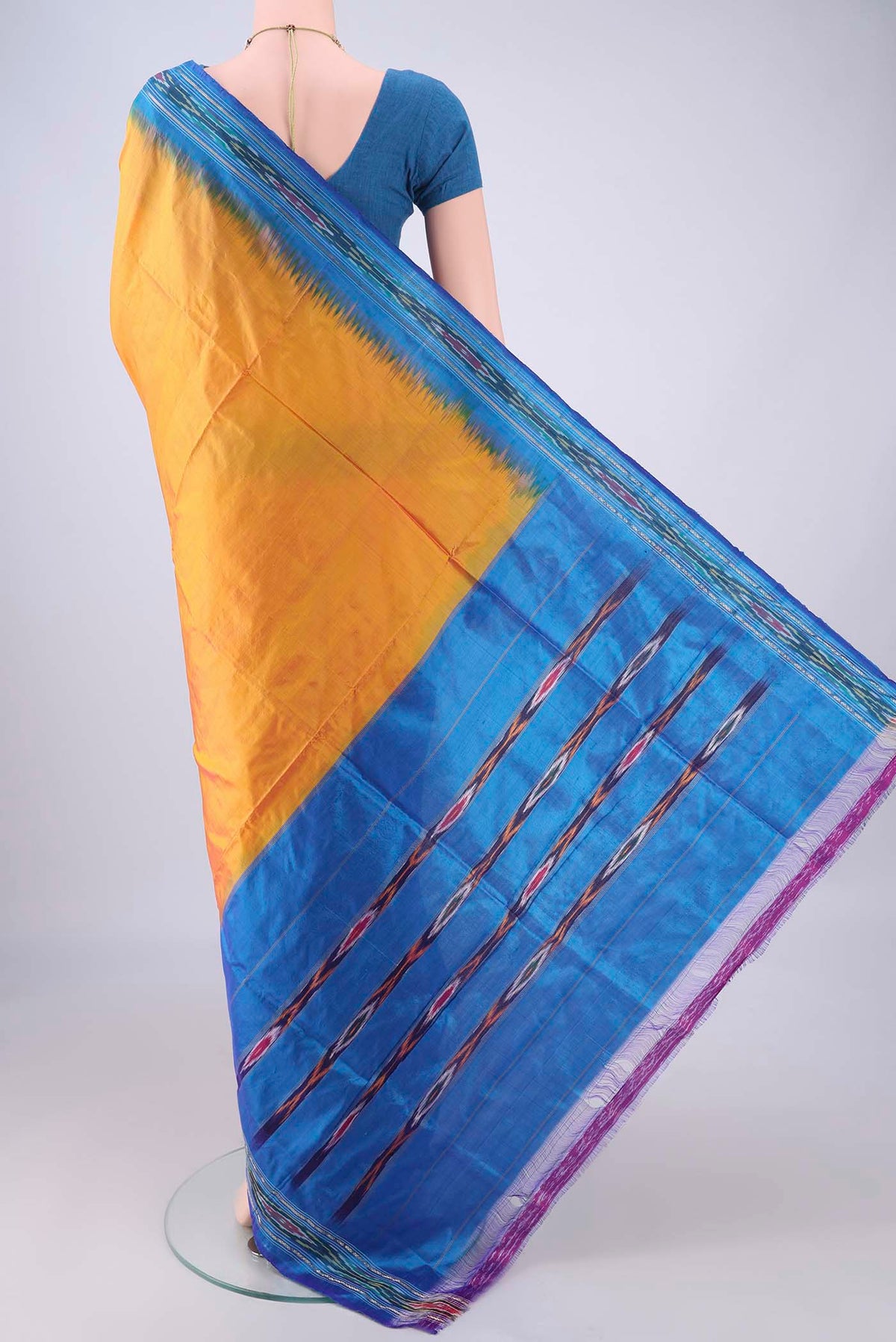 Flat view of Yellow Pochampally Silk Saree with Plain Body and Ikat Border. 