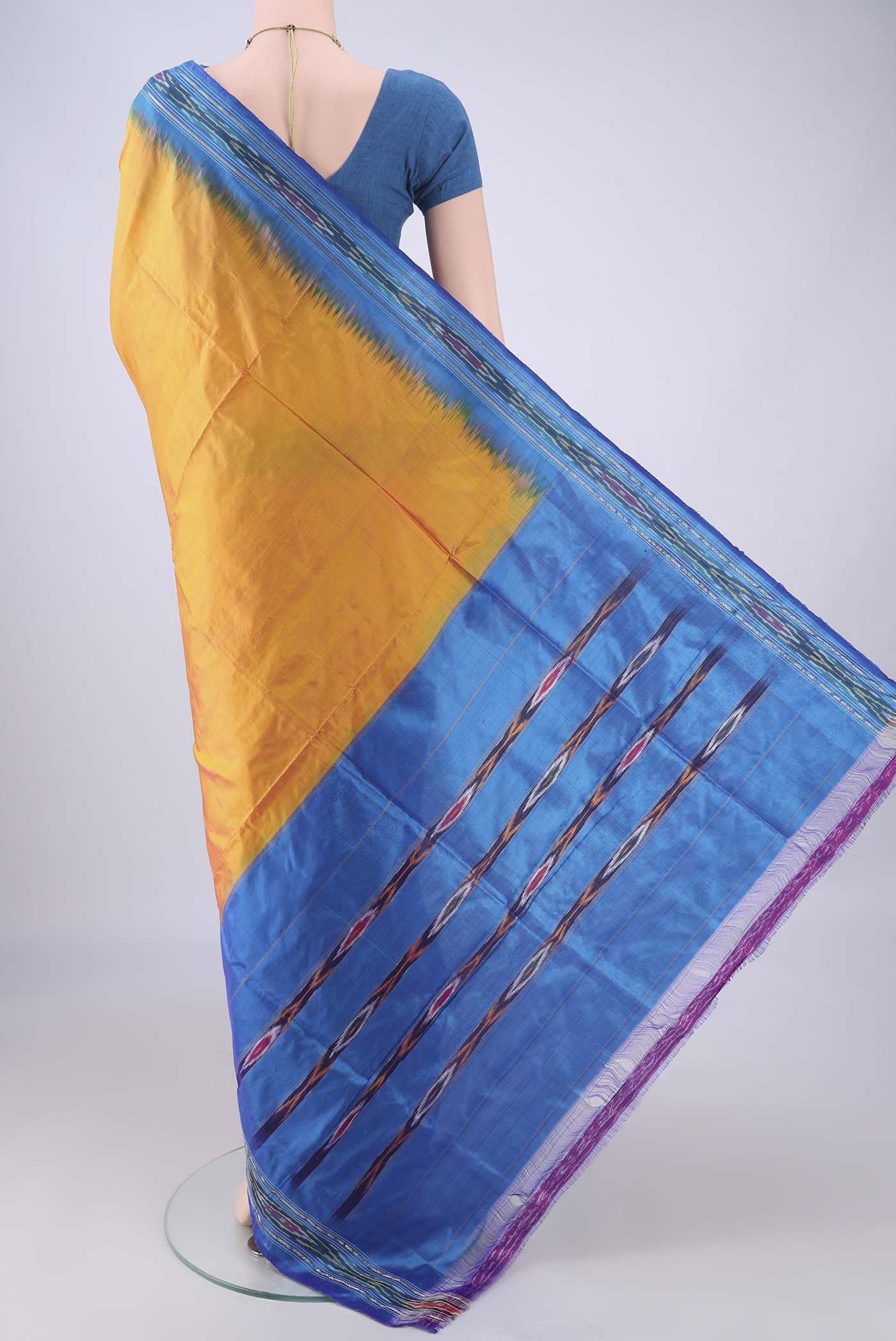 Flat view of Yellow Pochampally Silk Saree with Plain Body and Ikat Border. 