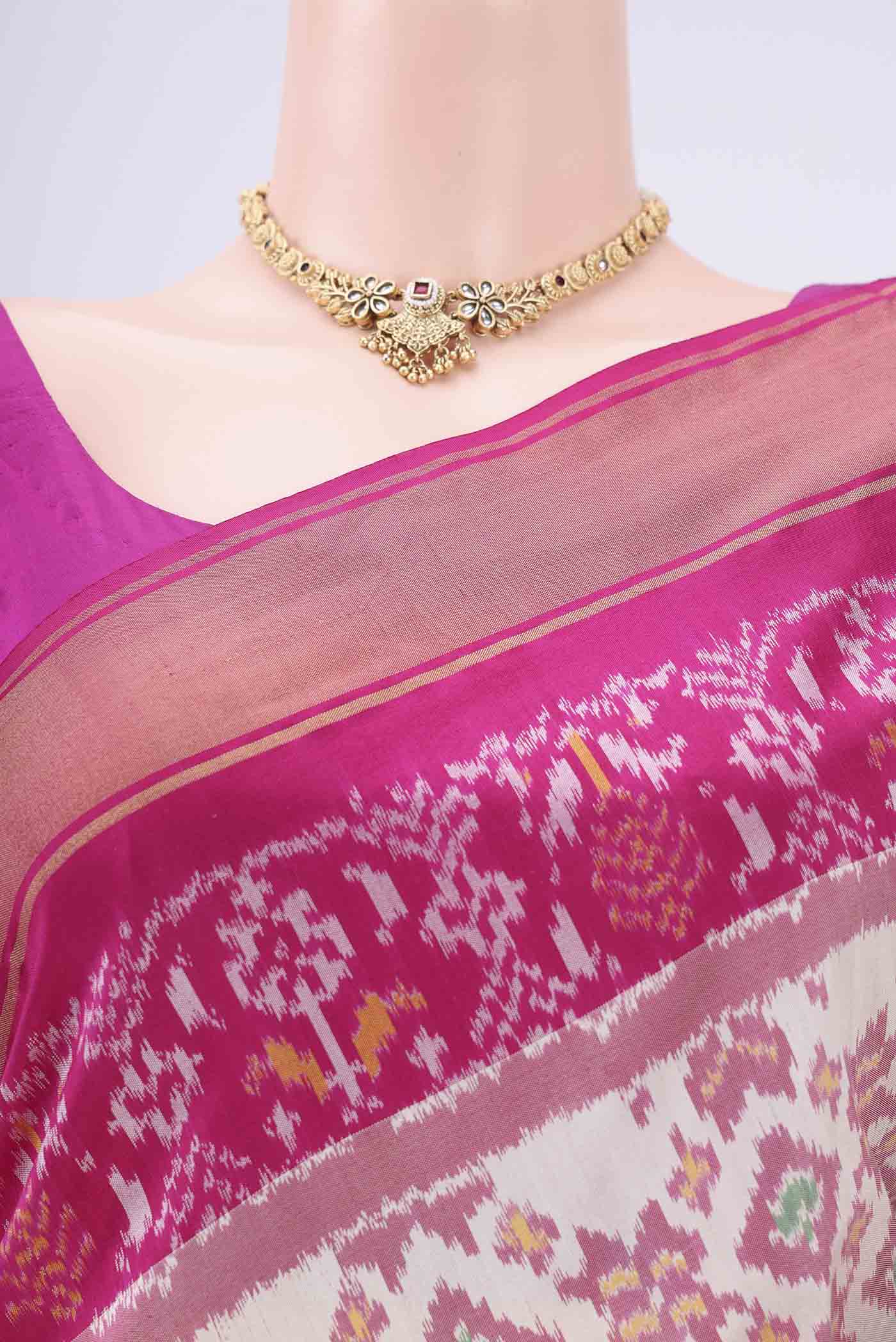 Border image of Off White Pochampally Silk Saree with Ikat design on the body and Zari Border. 