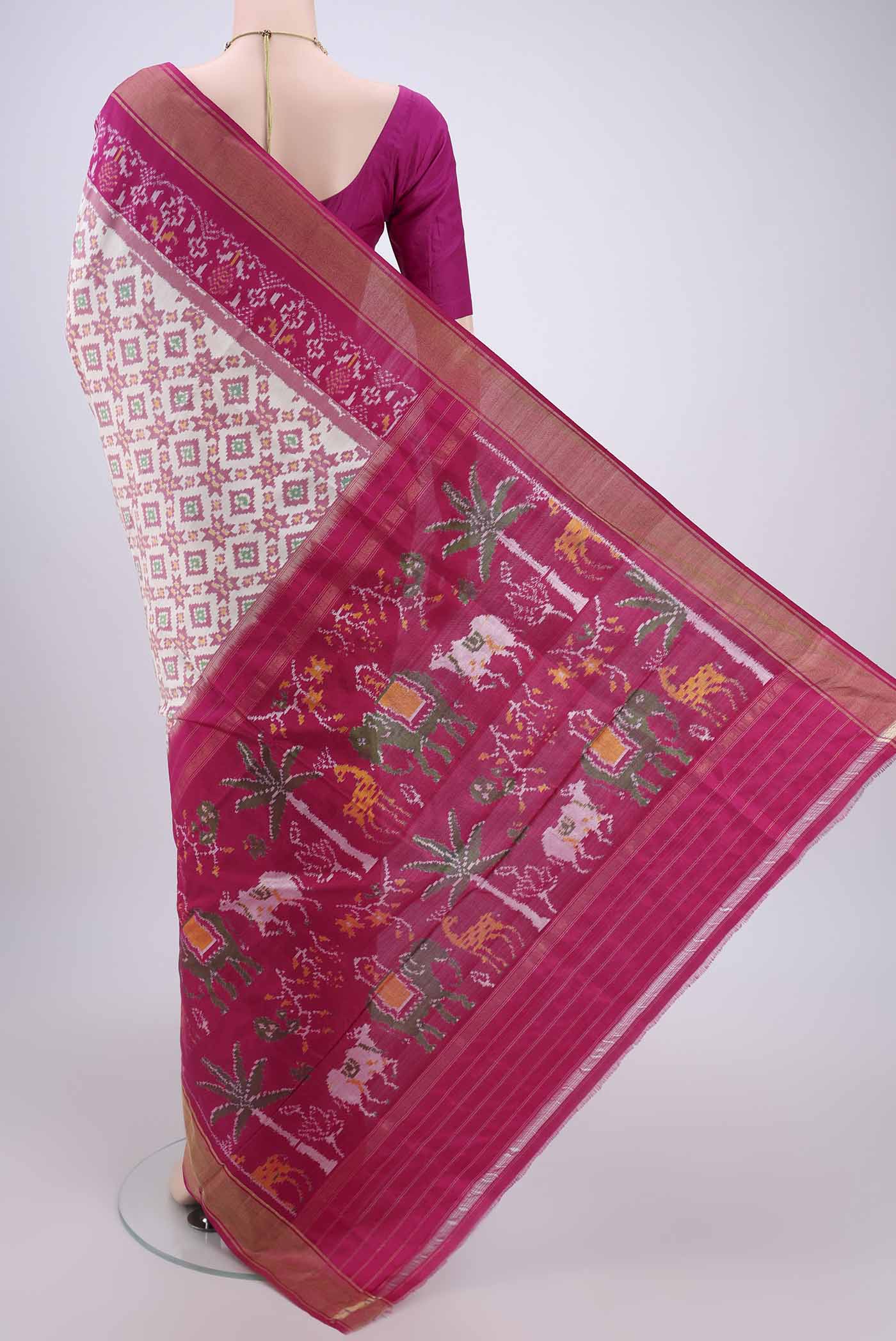 Flat view of Off White Pochampally Silk Saree with Ikat design on the body and Zari Border. 