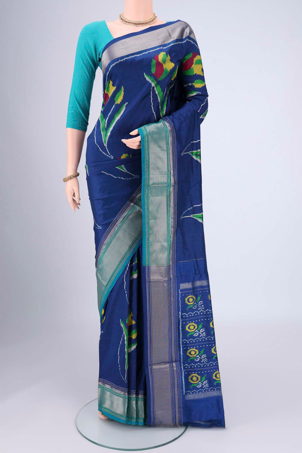 Blue Pochampally Silk Saree with Pure Ikat on the body and Zari Border.  displayed on a mannequin