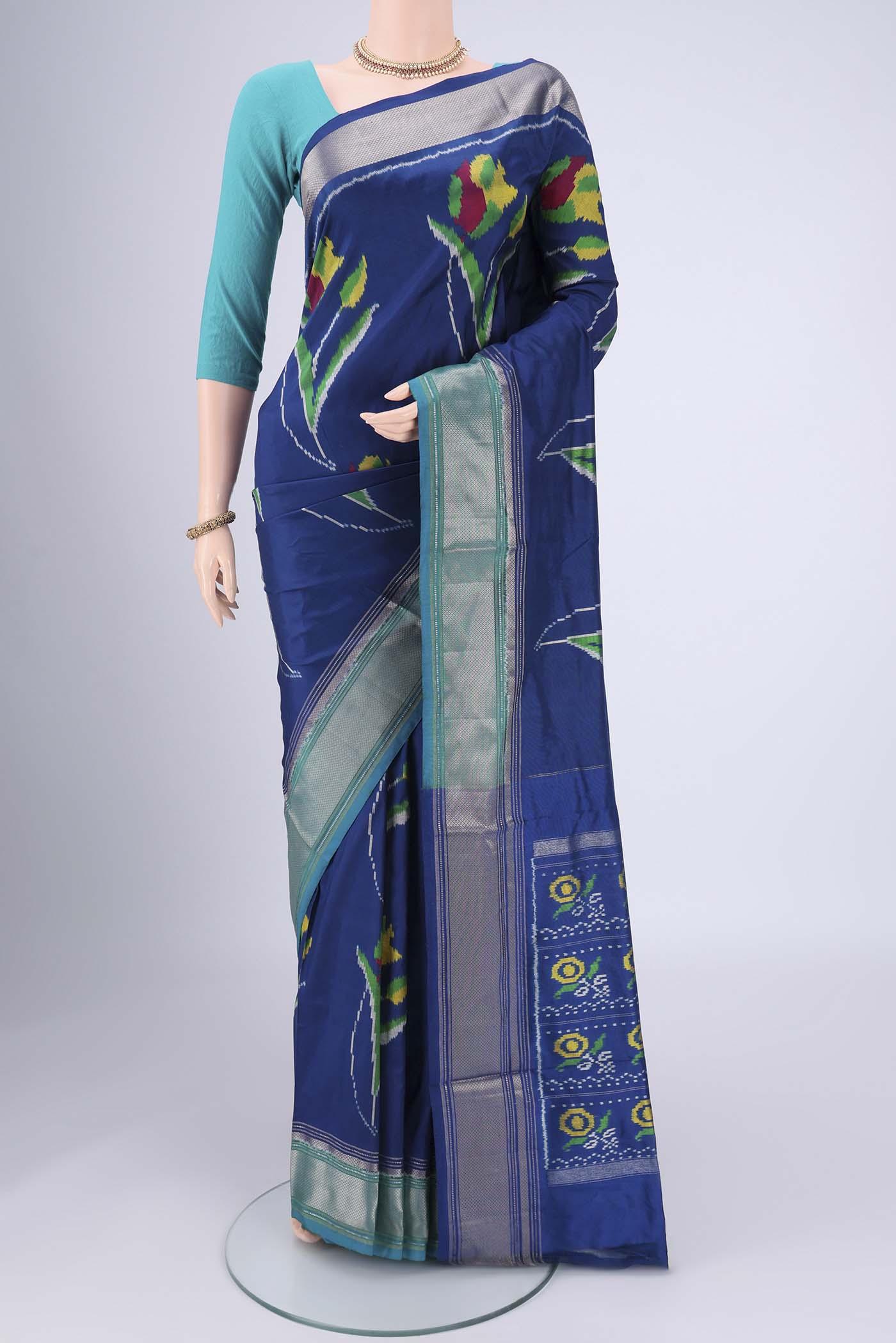 Blue Pochampally Silk Saree with Pure Ikat on the body and Zari Border.  displayed on a mannequin