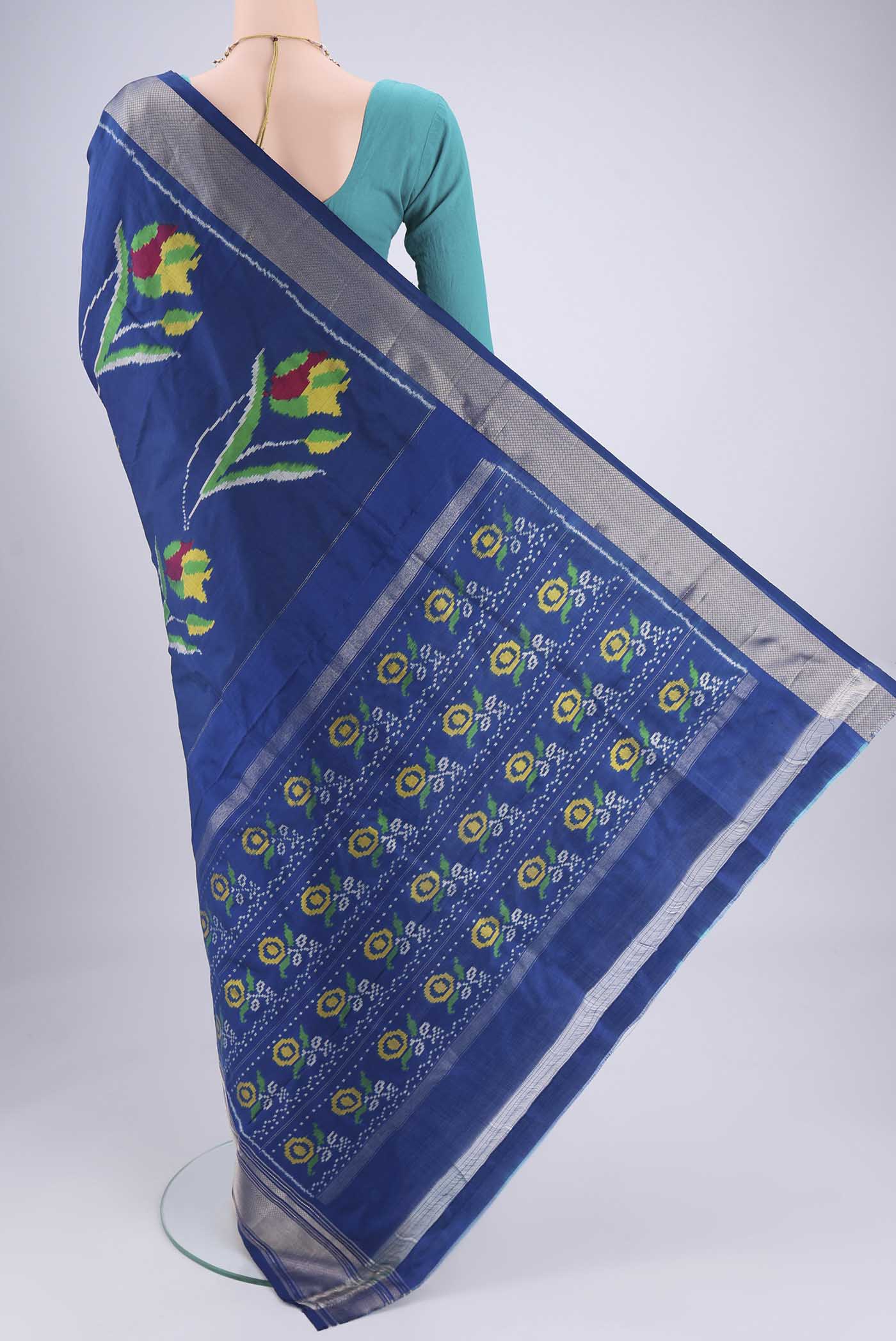 Flat view of Blue Pochampally Silk Saree with Pure Ikat on the body and Zari Border. 