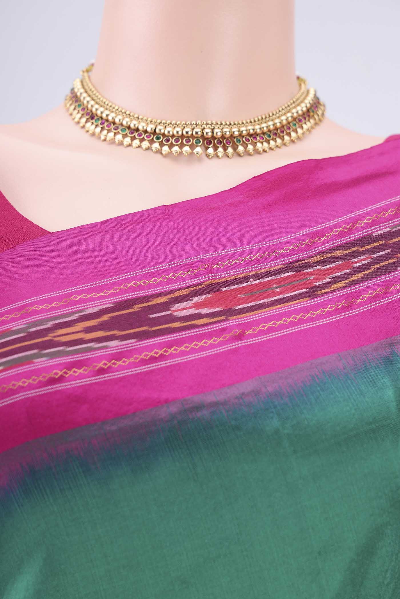 Border image of Green Pochampally Silk Saree with Plain Body and Ikat Border. 
