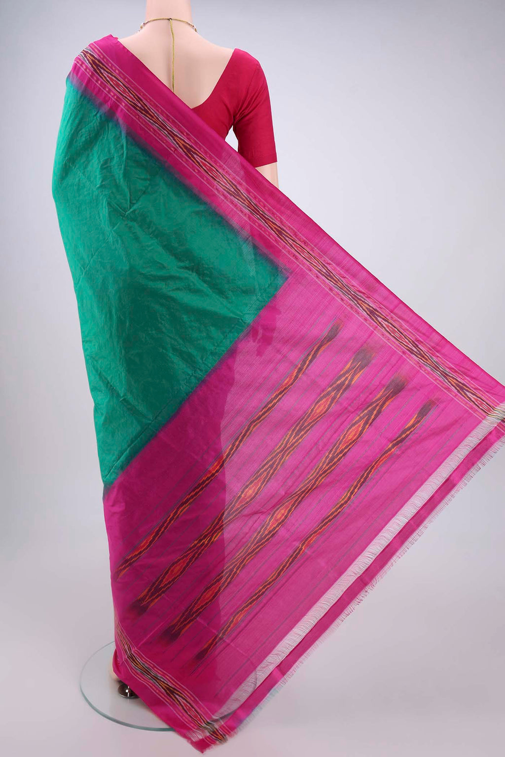 Flat view of Green Pochampally Silk Saree with Plain Body and Ikat Border. 