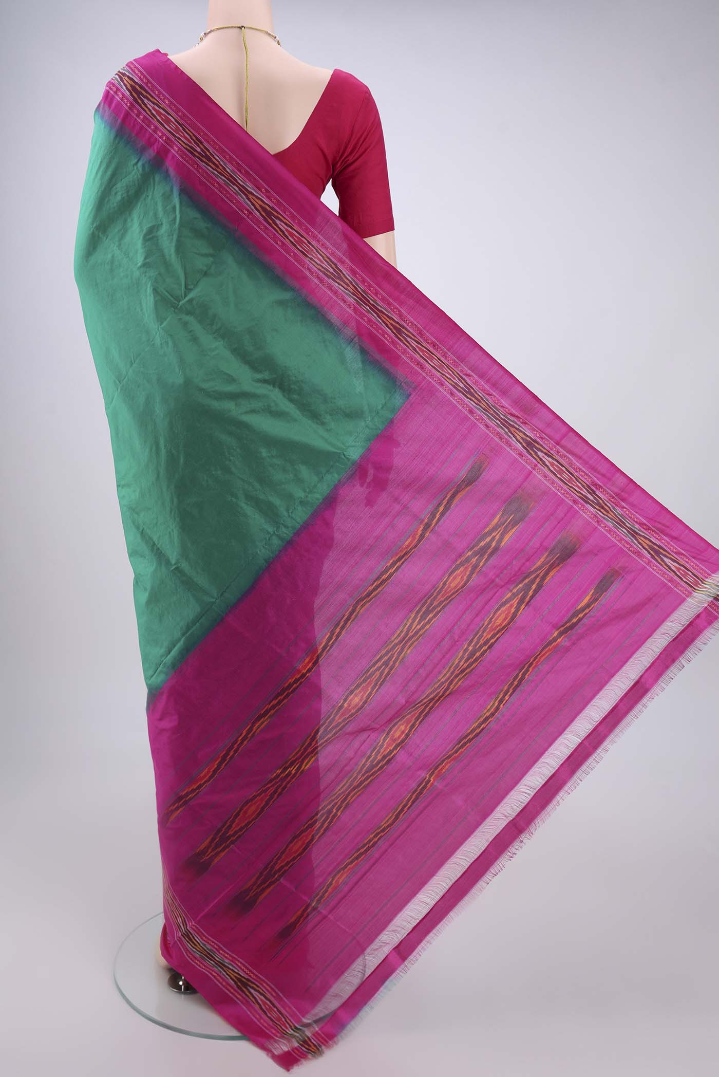 Flat view of Green Pochampally Silk Saree with Plain Body and Ikat Border. 
