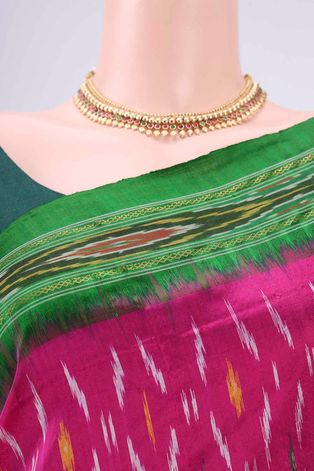 Border image of Rani Pink Pochampally Silk Saree with Ikat design on the body and Plain Border. 