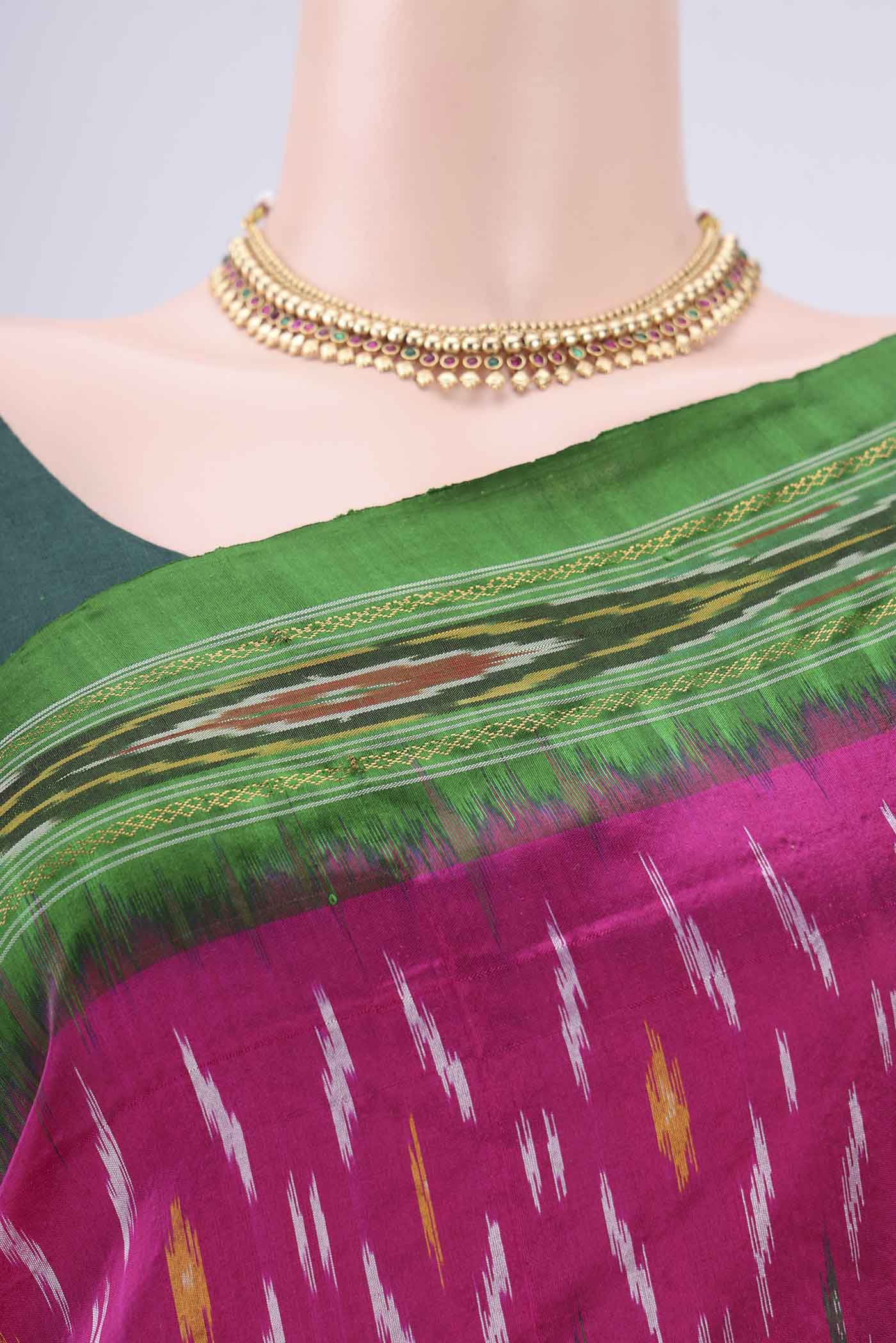 Border image of Rani Pink Pochampally Silk Saree with Ikat design on the body and Plain Border. 