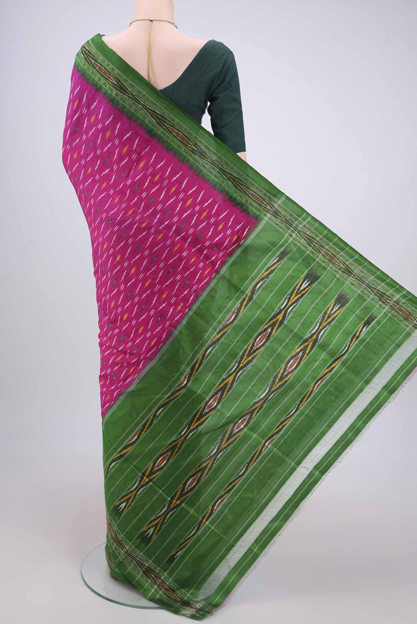 Flat view of Rani Pink Pochampally Silk Saree with Ikat design on the body and Plain Border. 