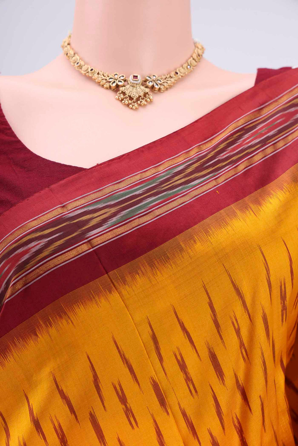Border image of Yellow Pochampally Silk Saree with Ikat design on the body and Plain Border. 