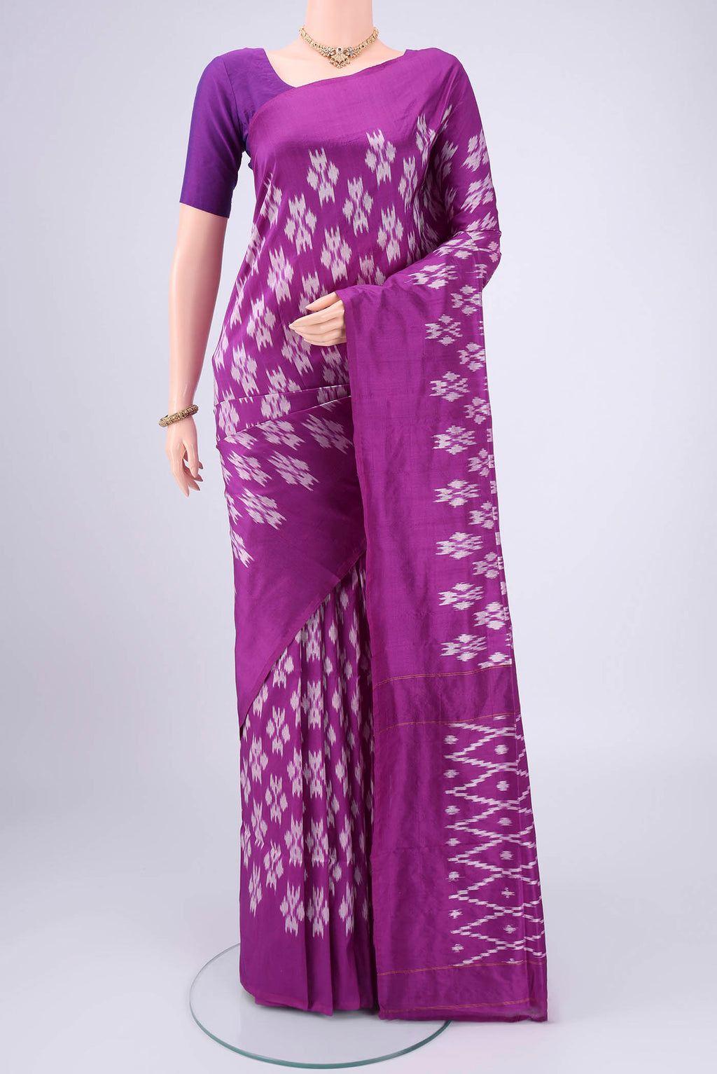 Violet Pochampally Silk Saree with Ikat design on the body and Plain Border.  displayed on a mannequin
