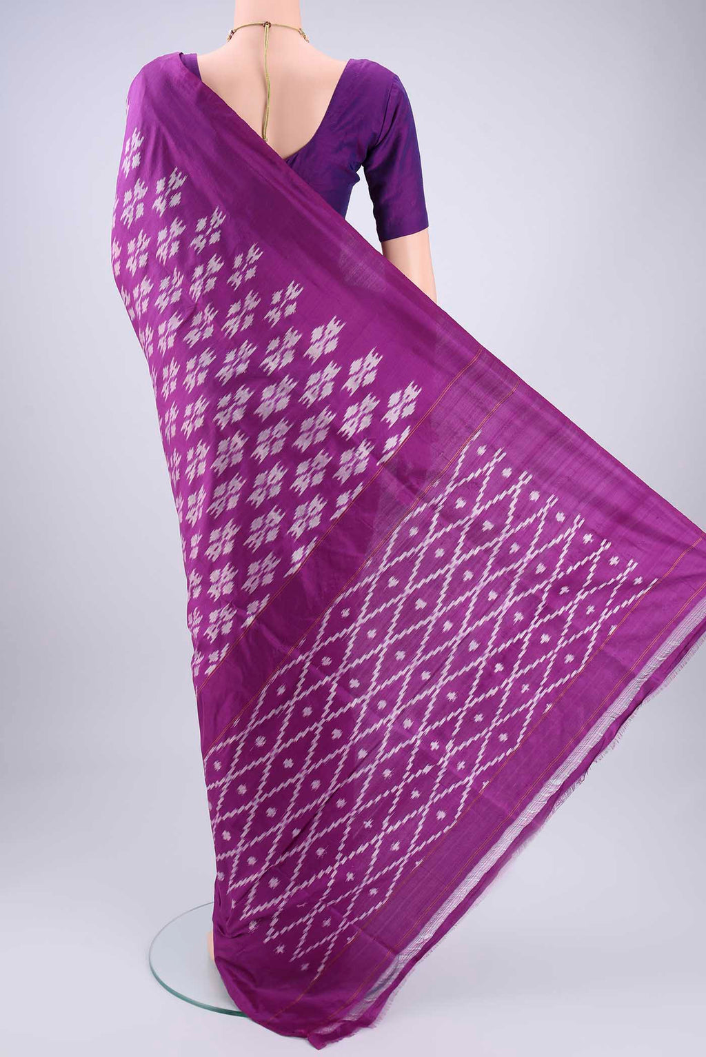 Flat view of Violet Pochampally Silk Saree with Ikat design on the body and Plain Border. 