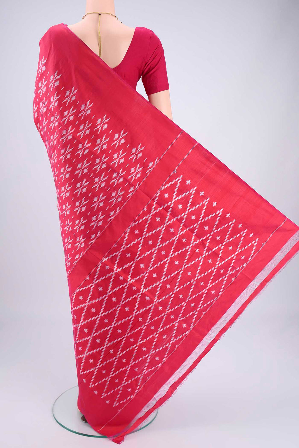 Flat view of Rani Pink Pochampally Silk Saree with Checked design on the body and Plain Border. 