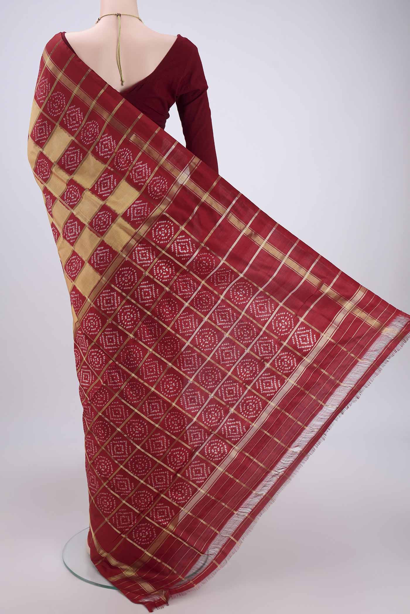 Flat view of Peach Pochampally Silk Saree with Checked design on the body and Zari Border. 