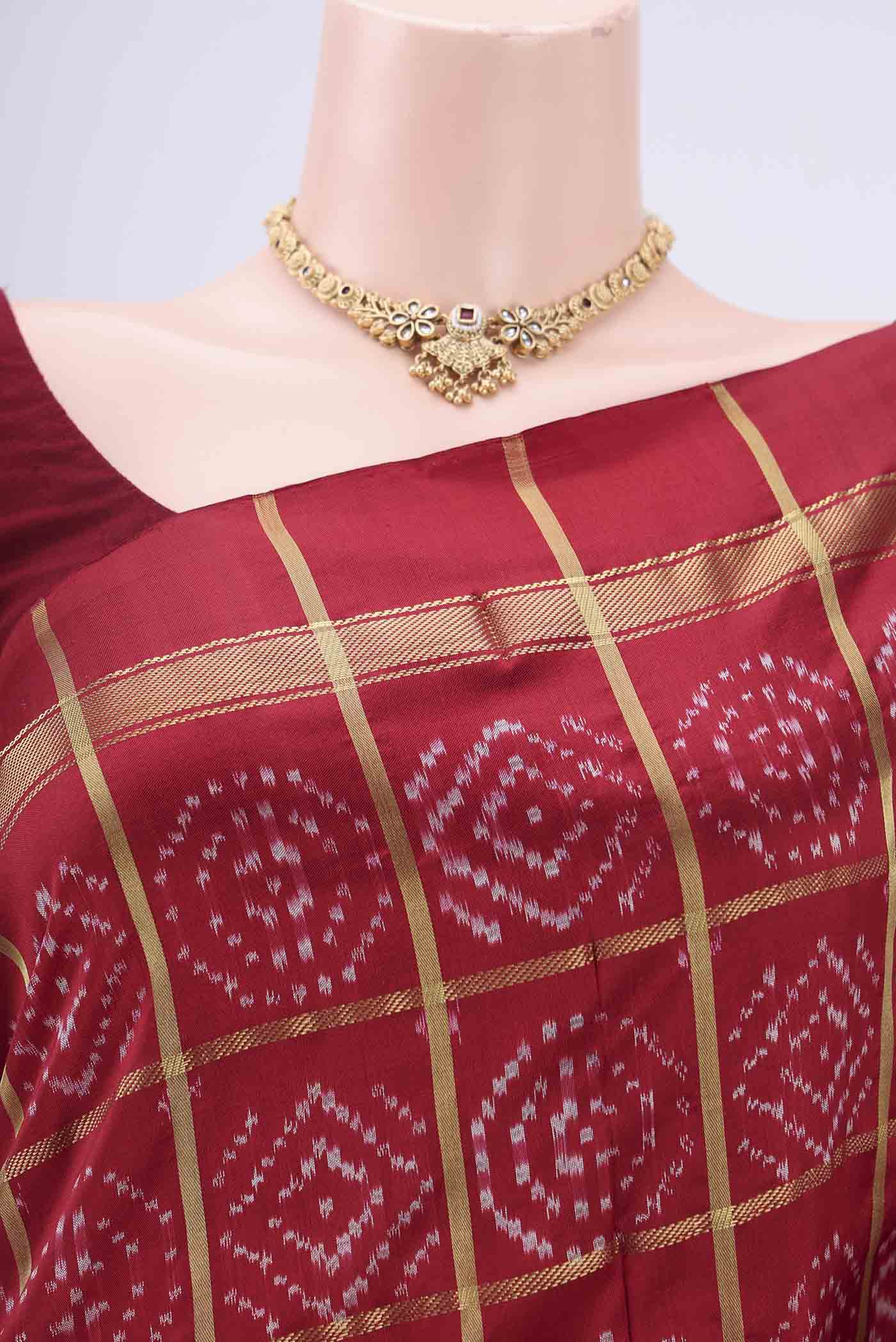 Border image of Maroon Pochampally Silk Saree with Checked design on the body and Zari Border. 