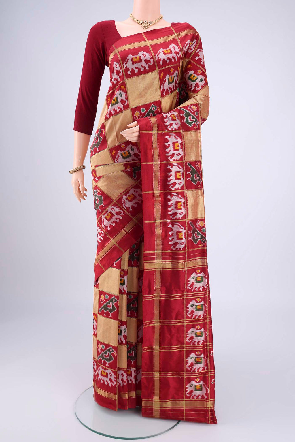 Multi Color Pochampally Silk Saree with Checked design on the body and Zari Border.  displayed on a mannequin