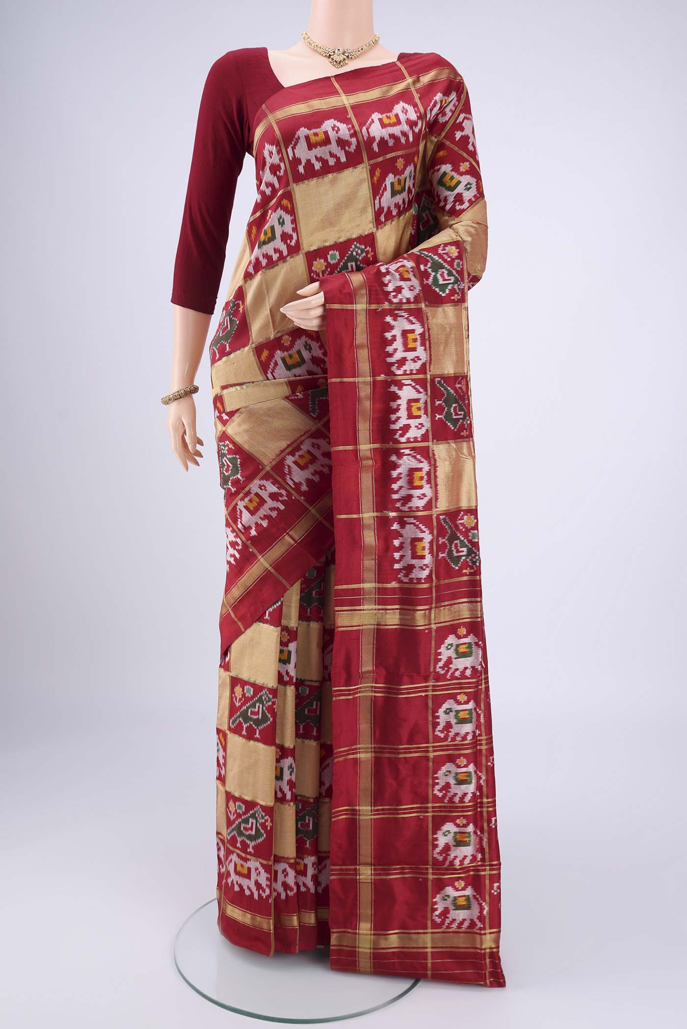 Multi Color Pochampally Silk Saree with Checked design on the body and Zari Border.  displayed on a mannequin