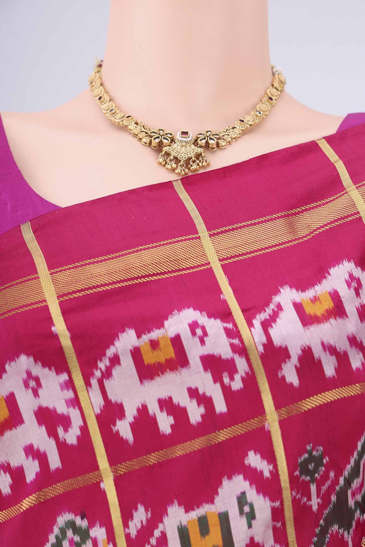 Border image of Rani Pink Pochampally Silk Saree with Checked design on the body and Plain Border. 