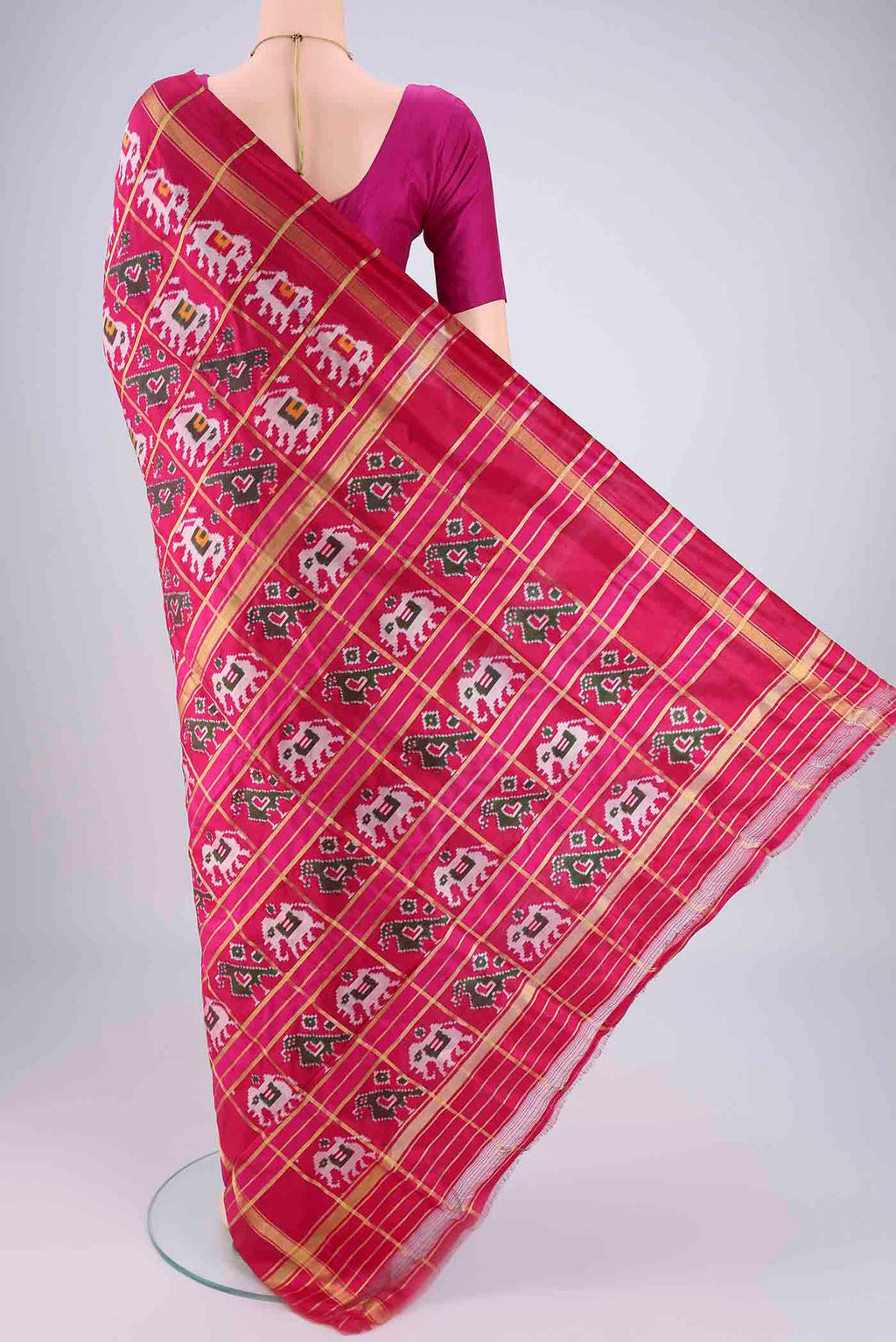 Flat view of Rani Pink Pochampally Silk Saree with Checked design on the body and Plain Border. 