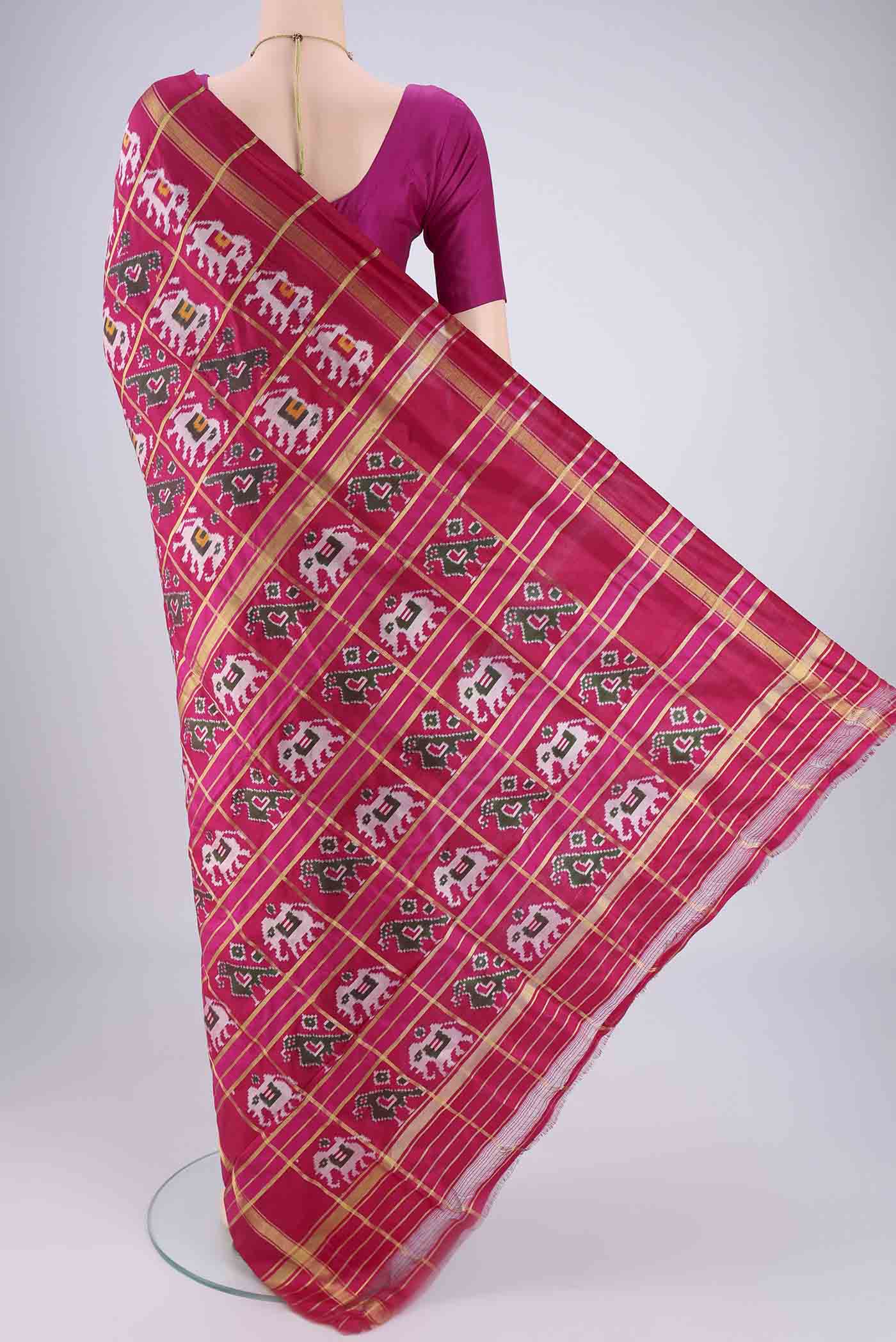 Flat view of Rani Pink Pochampally Silk Saree with Checked design on the body and Plain Border. 