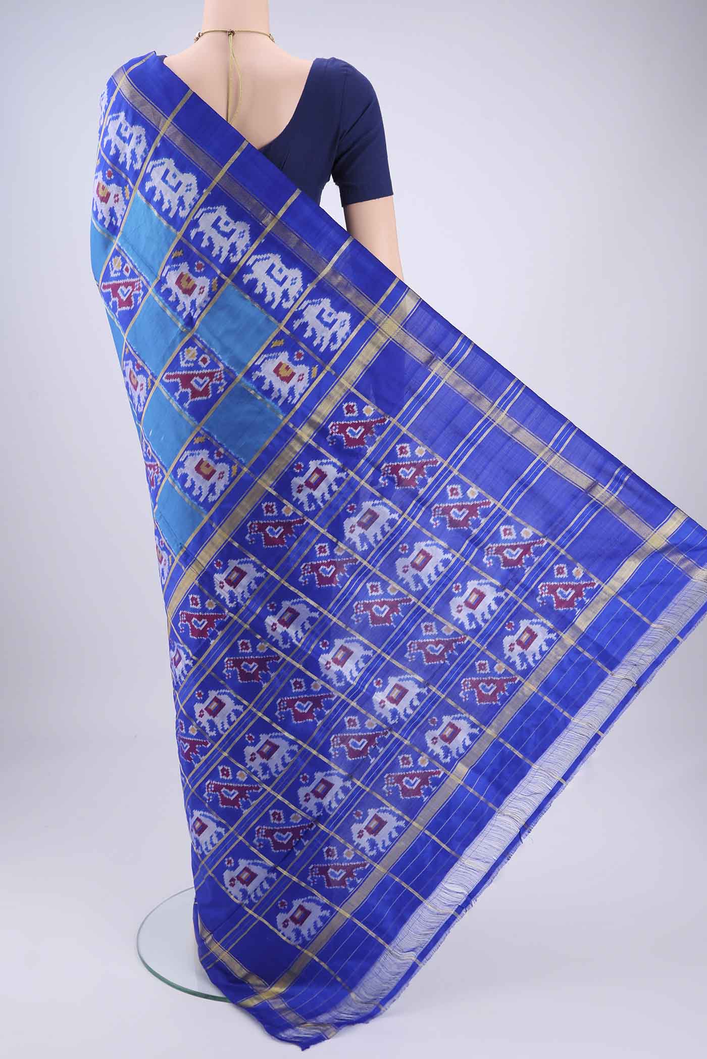 Flat view of Multi Color Pochampally Silk Saree with Checked design on the body and Zari Border. 