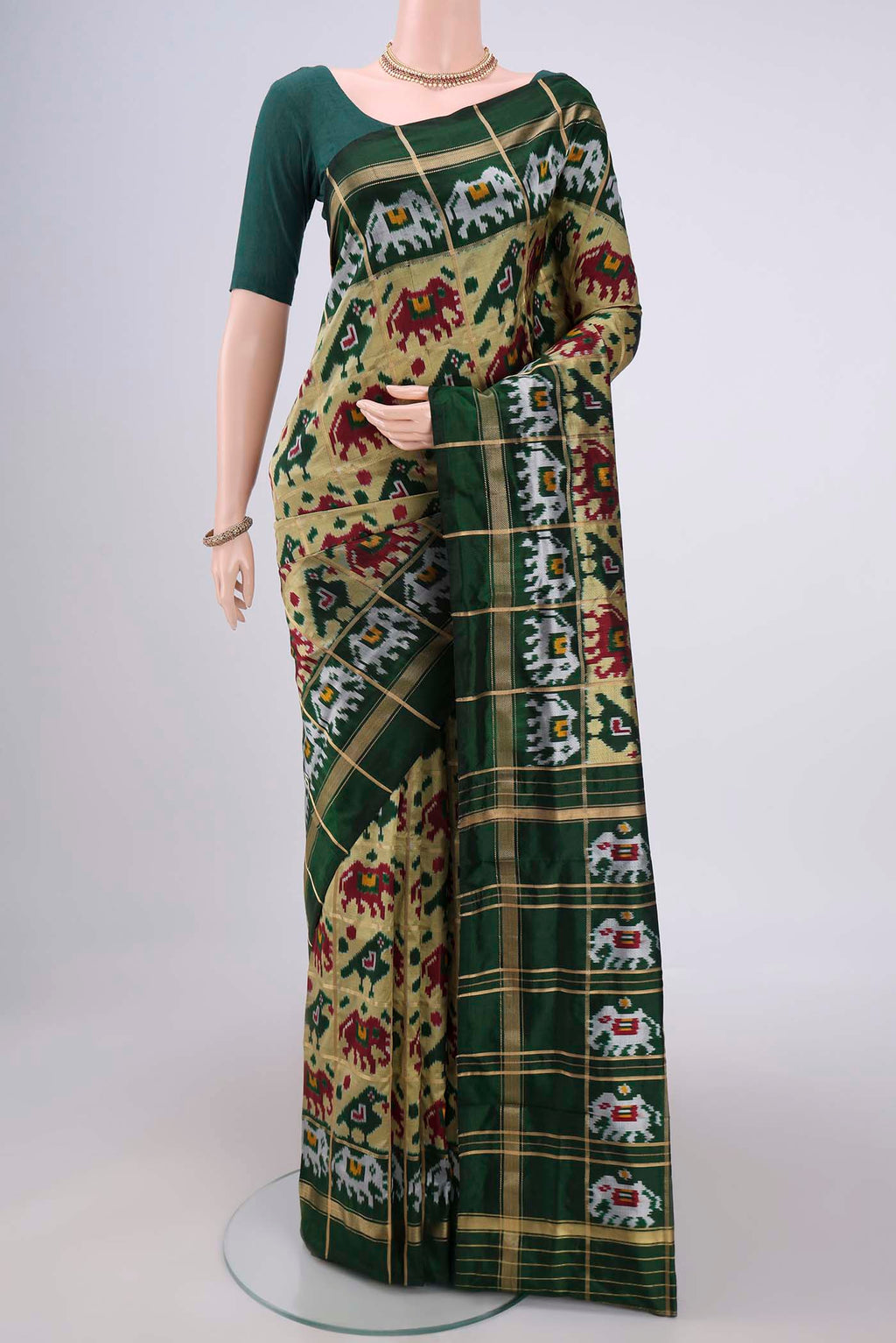 Multi Color Pochampally Silk Saree with Checked design on the body and Zari Border.  displayed on a mannequin