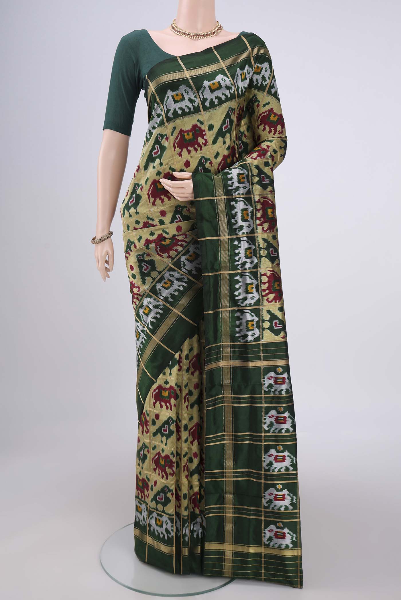 Multi Color Pochampally Silk Saree with Checked design on the body and Zari Border.  displayed on a mannequin