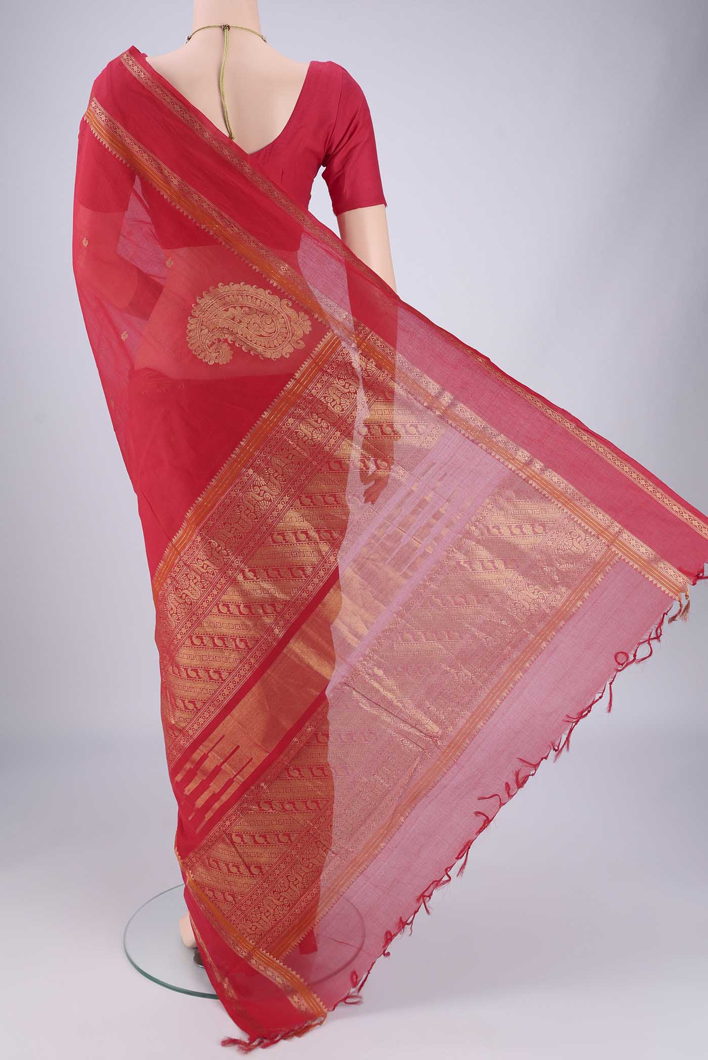 Flat view of Red Kanchi Cotton Saree with Zari Butta on the body and Zari Border. 