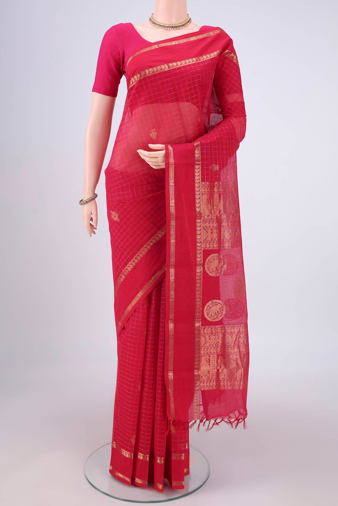 Dark Pink Kanchi Cotton Saree with Checked design on the body and Zari Border.  displayed on a mannequin