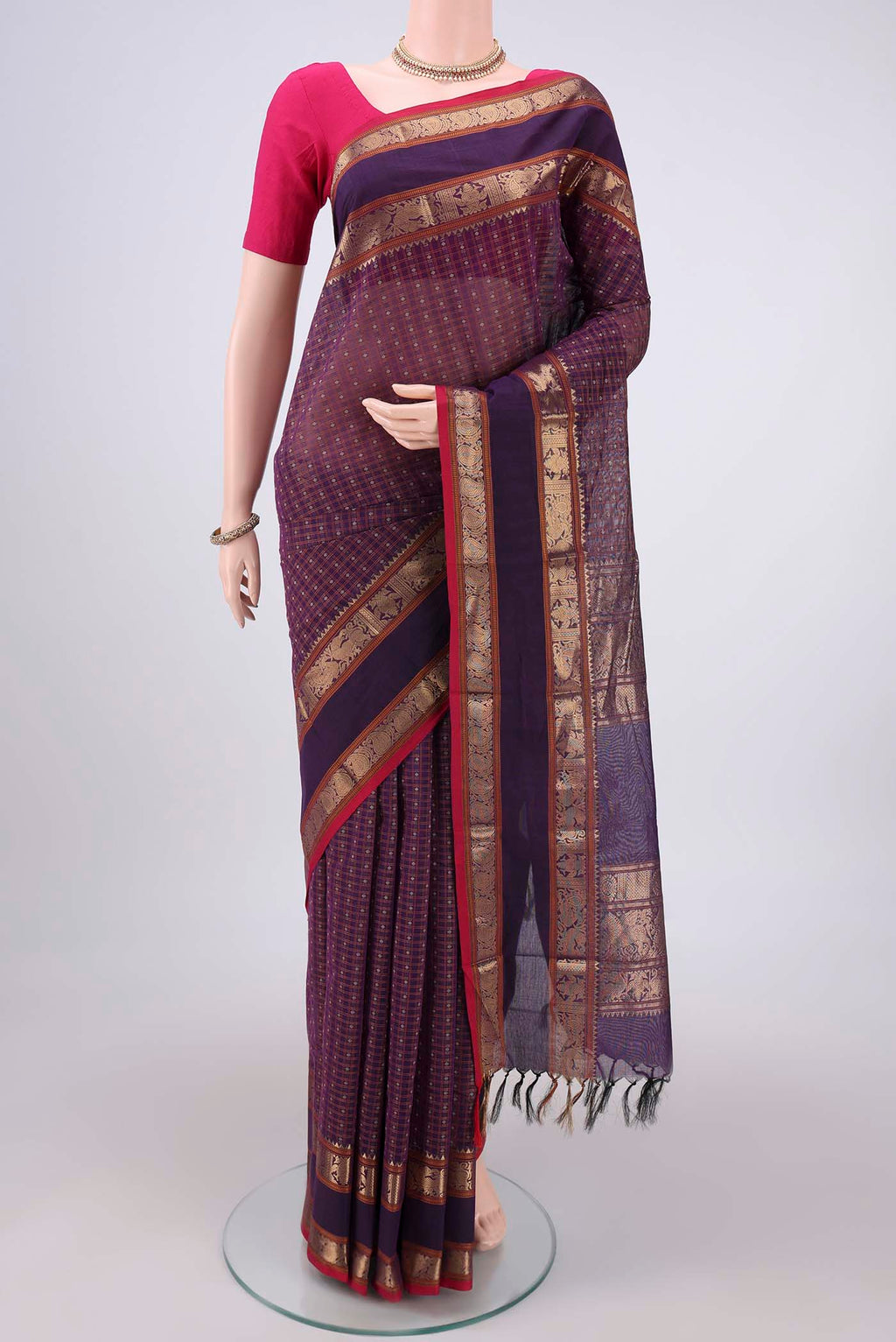 Purple Kanchi Cotton Saree with Checked design on the body and Zari Border.  displayed on a mannequin