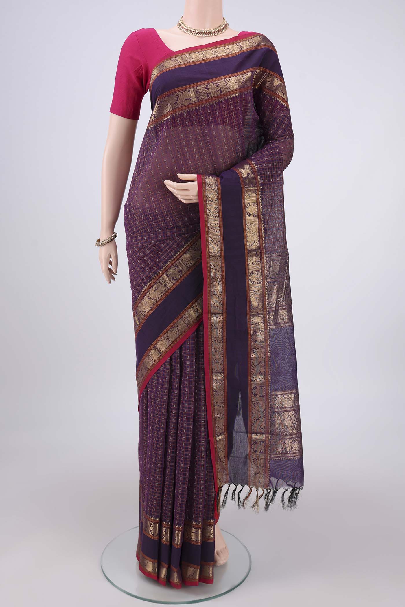 Purple Kanchi Cotton Saree with Checked design on the body and Zari Border.  displayed on a mannequin