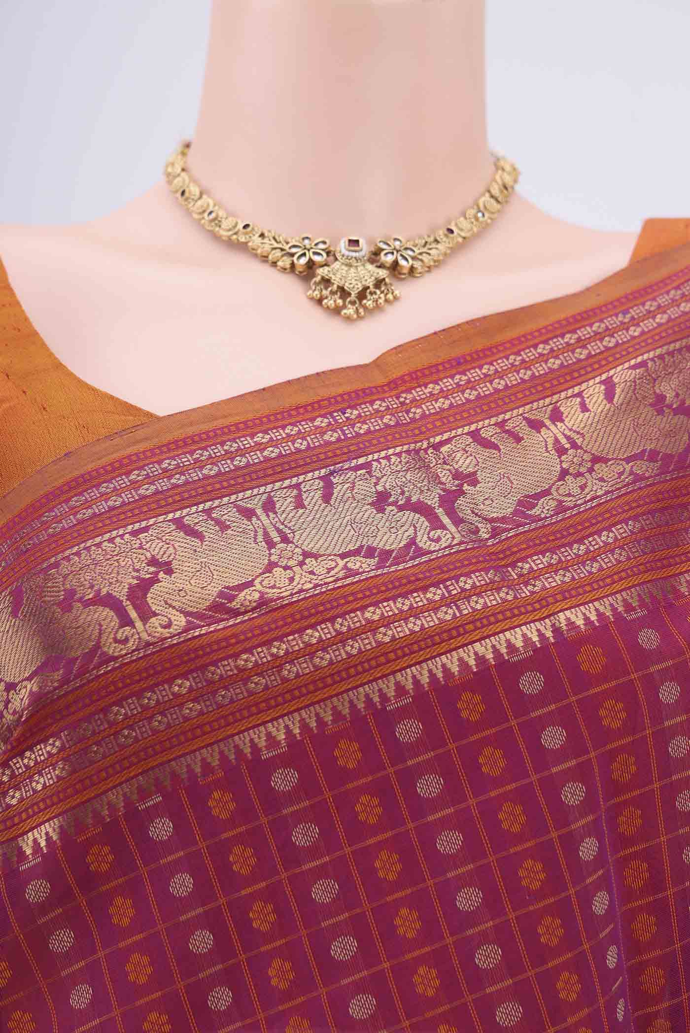 Border image of Magenta Kanchi Cotton Saree with Checked design on the body and Zari Border. 