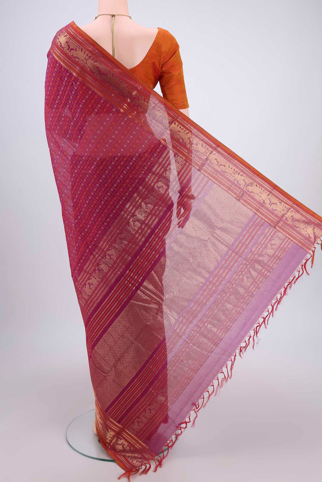 Flat view of Magenta Kanchi Cotton Saree with Checked design on the body and Zari Border. 