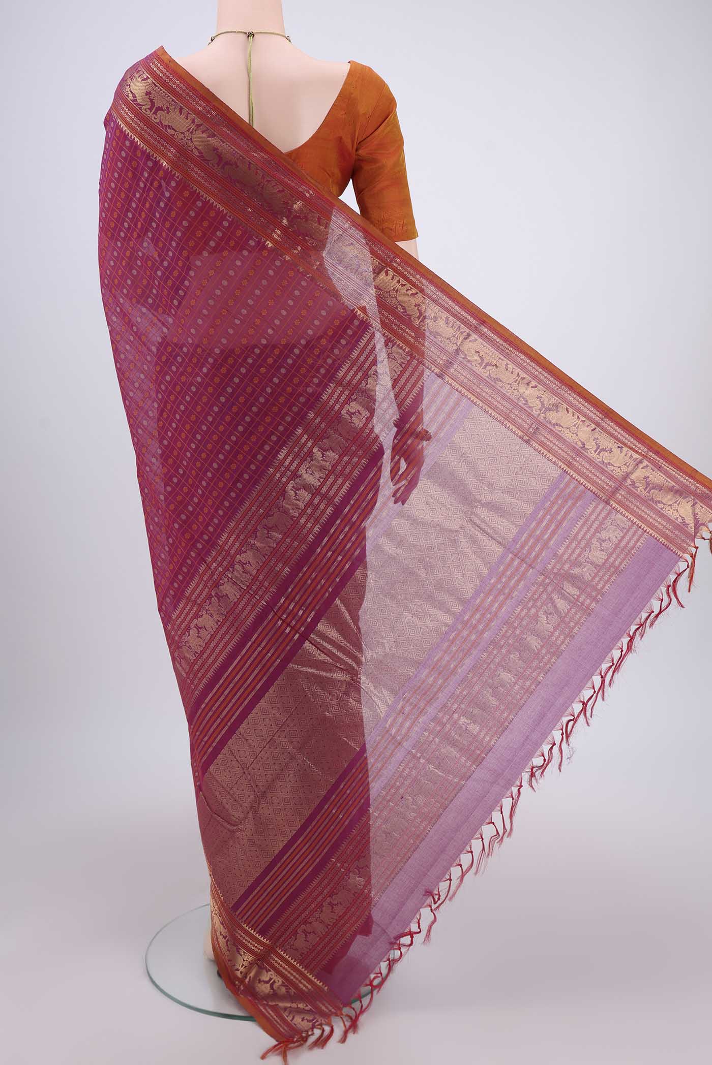 Flat view of Magenta Kanchi Cotton Saree with Checked design on the body and Zari Border. 