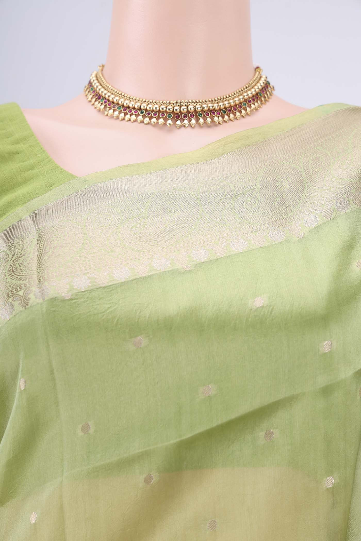Border image of Light Green Banarasi Raw Silk Saree with Zari Butta on the body and Zari Border. 