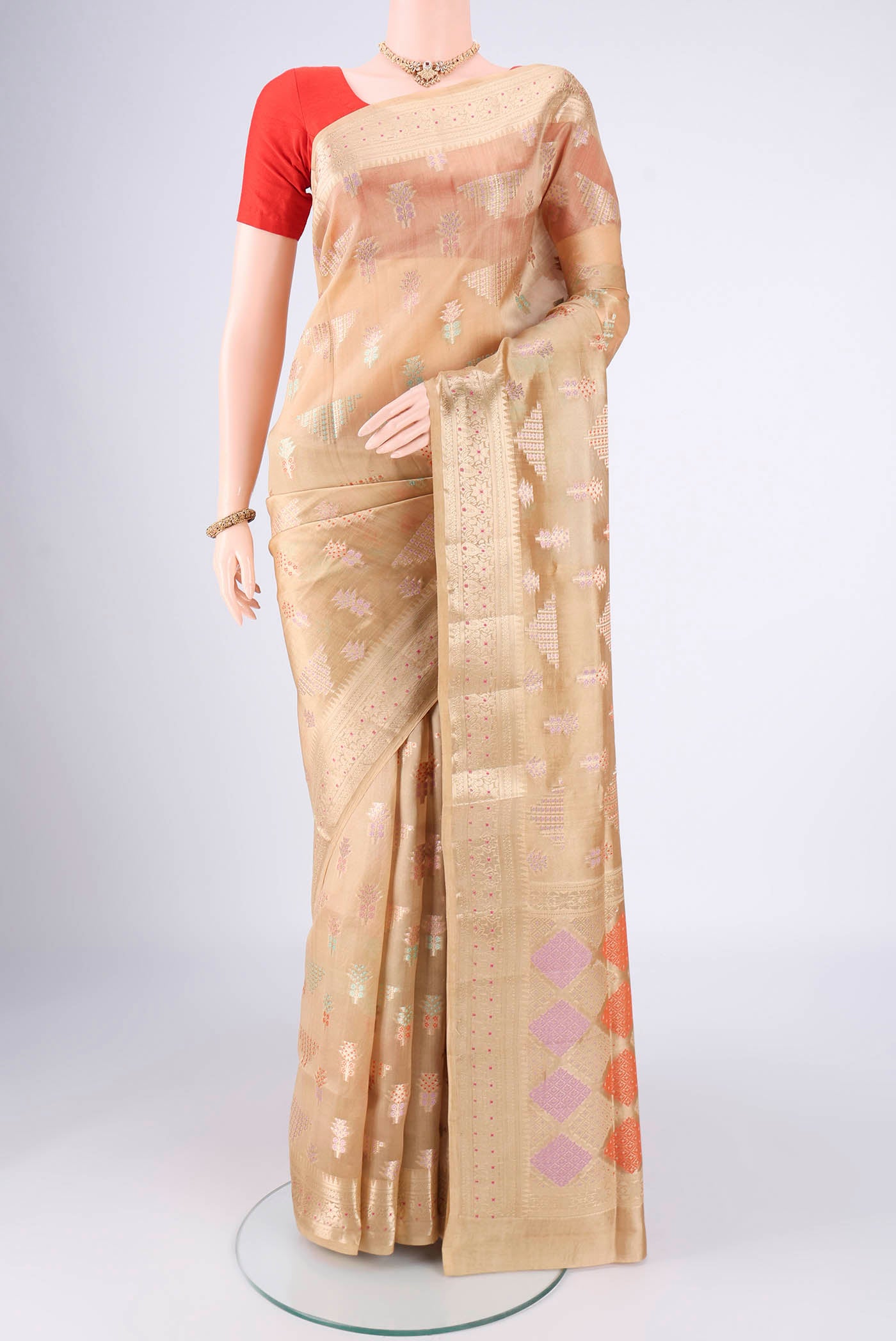 Dark Beige Banarasi Raw Silk Saree with Zari Butta on the body and Zari Border.  displayed on a mannequin
