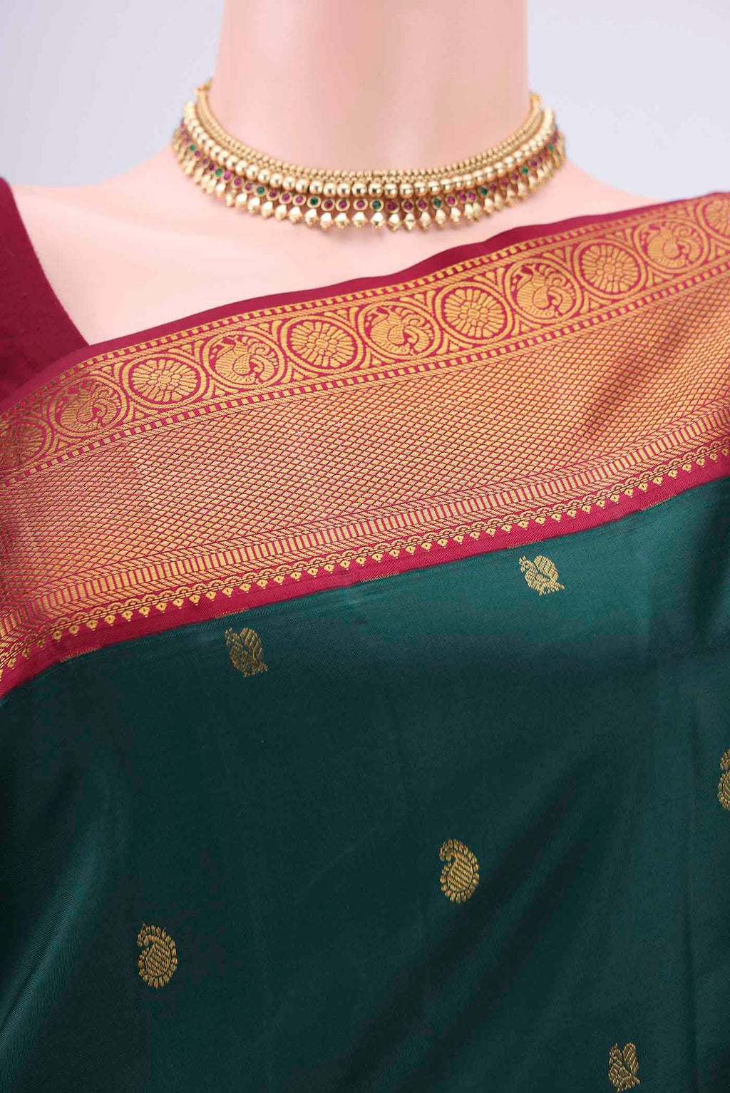 Border image of Bottle Green Kanjivaram Silk Saree with Zari Butta on the body and Zari Border. 