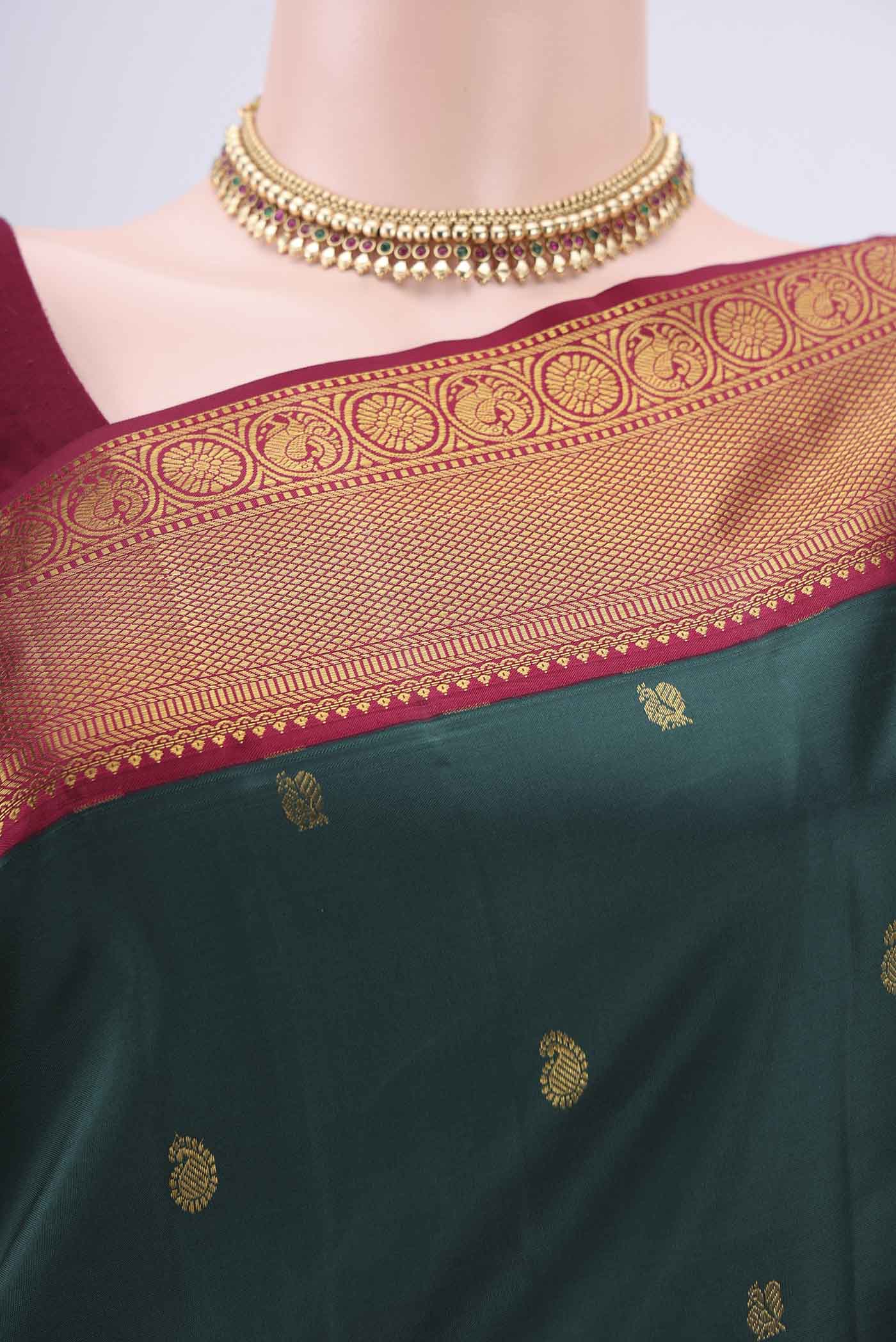 Border image of Bottle Green Kanjivaram Silk Saree with Zari Butta on the body and Zari Border. 