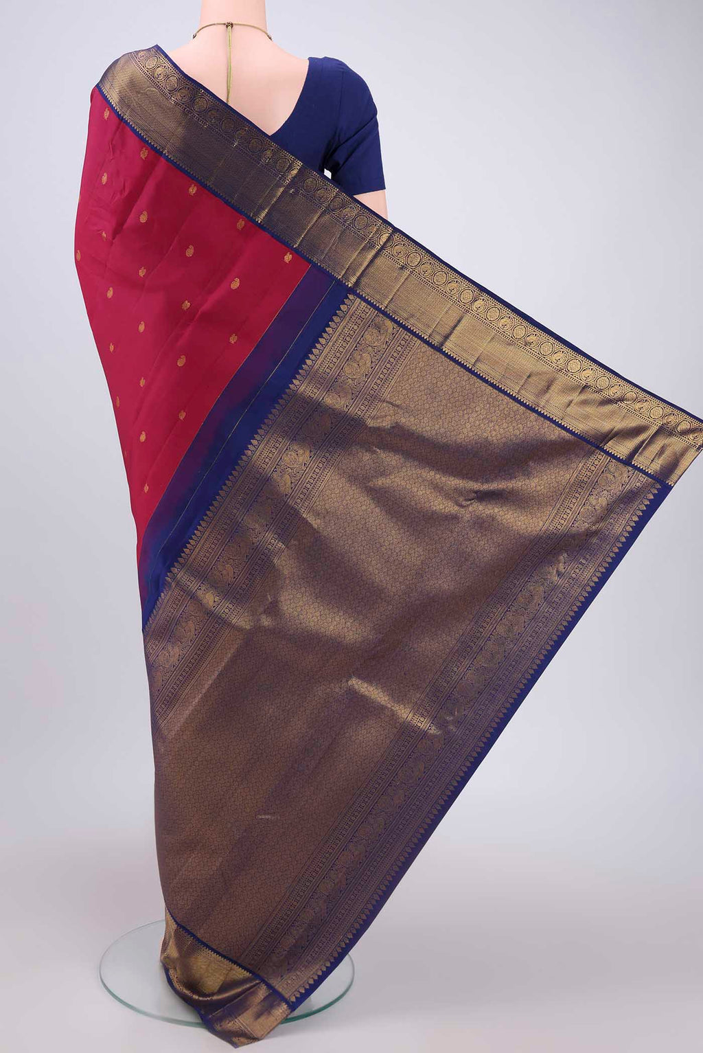 Flat view of Dark Pink Kanjivaram Silk Saree with Zari Butta on the body and Zari Border. 